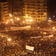 Anti-government protestors defy the curfew in Tahrir Square on February 1, 2011 in Cairo, Egypt. Photo via Getty.